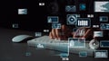 Hands Typing on Keyboard with Data Visualizations and Graphs Overlaid on Screen in a Modern Office Setting xenic Royalty Free Stock Photo