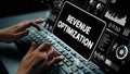 Hands Typing on Keyboard with Digital Graphics Displaying Revenue Optimization Concepts and Data Visualization Elements Royalty Free Stock Photo