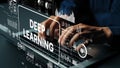 Hands Typing on Keyboard with Digital Interface Displaying Deep Learning Concepts and Data Analytics in Technology Royalty Free Stock Photo