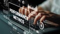 Hands Typing on Keyboard with Digital Performance Metrics and Data Visualization Displayed in Modern Office Setting Royalty Free Stock Photo