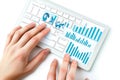 Hands typing on a keyboard displaying financial charts and global data analytics Royalty Free Stock Photo