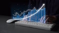 Hands Typing on Keyboard with Dynamic Digital Graph Displaying Growth and Progress in Business Analytics and Data Royalty Free Stock Photo