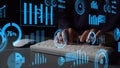 Hands typing on keyboard with dynamic visual data analysis interface displaying charts, graphs, and statistics for Royalty Free Stock Photo