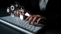 Hands Typing on Keyboard with Graphical User Interface Elements Representing Technology Concepts Such as Data, Cloud Royalty Free Stock Photo