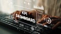 Hands Typing on Keyboard with KPI Dashboard Display on Screen, Data Visualization, and Analytics Elements in Modern Royalty Free Stock Photo