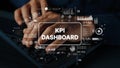 Hands Typing on Keyboard with KPI Dashboard Graphics and Analytics Elements Displayed on Screen for Data Analysis Royalty Free Stock Photo