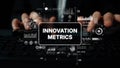 Hands Typing on Keyboard with Overlay of Innovation Metrics and Data Visualization Elements in a Modern Workspace Royalty Free Stock Photo