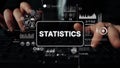Hands Typing on Keyboard with Overlay of Statistical Data Visualizations and Graphs Showing Analysis and Metrics Royalty Free Stock Photo