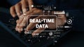 Hands Typing on Keyboard with Real-Time Data Graphics and Digital Interface Elements Displayed in Modern Workspace Royalty Free Stock Photo