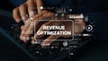 Hands Typing on Keyboard with Revenue Optimization Concept and Digital Graphics Illustrating Data Analysis and Business Royalty Free Stock Photo