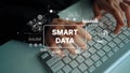 Hands Typing on Keyboard with Smart Data Concept and Graphical Elements Displayed over Image. Asymptotic smart data Royalty Free Stock Photo