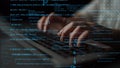 Hands Typing on Keyboard Surrounded by Digital Code and Data in a Dark Environment Representing Computer Programming and Royalty Free Stock Photo