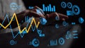 Hands Typing on Keyboard Surrounded by Digital Data Visualization Displaying Graphs and Metrics in a Modern Tech Royalty Free Stock Photo