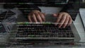 Hands Typing on Keyboard Surrounded by Lines of Code in Dark Environment, Concept of Programming, Software Development Royalty Free Stock Photo