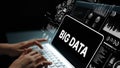 Hands Typing on Laptop with Big Data Graphics and Analytics Display for Data Science and Technology Concepts. Asymptotic Royalty Free Stock Photo