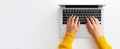 The hands typing on a laptop with a bright yellow sweater. AI generated image Royalty Free Stock Photo