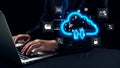 Hands Typing on Laptop with Cloud Computing Icons Floating Above, Representing Modern Technology, Data Storage, and Royalty Free Stock Photo