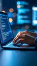 Hands typing on laptop with coding on screen, illuminated by a blurred background. Royalty Free Stock Photo