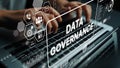 Hands Typing on Laptop with Data Governance Concept and Technology Graphics Displayed on Screen. Asymptotic smart data Royalty Free Stock Photo