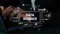 Hands Typing on Laptop with Data Science Graphics and Metrics Overlay for Technology and Analytics Themes. Asymptotic Royalty Free Stock Photo