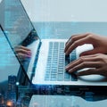 Hands Typing on Laptop with Digital Code Overlay. Software Development & Tech City Royalty Free Stock Photo