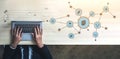 Hands typing on laptop with digital network graphics, symbolizing technology, communication, and data exchange in a Royalty Free Stock Photo