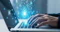 Hands typing on a laptop with a digital security interface and glowing data streams Royalty Free Stock Photo