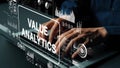 Hands Typing on Laptop with Digital Value Analytics Dashboard and Graphs Overlay for Business Intelligence. Asymptotic Royalty Free Stock Photo
