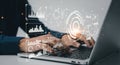 Hands typing on laptop with futuristic digital data overlays and glowing analytics interface Royalty Free Stock Photo