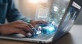 Hands typing on a laptop with futuristic digital data visualizations and glowing technology elements emerging from the screen Royalty Free Stock Photo