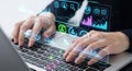 Hands typing on laptop with futuristic digital interface displaying data and analytics Royalty Free Stock Photo