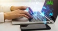 Hands typing on laptop with glowing digital data stream technology concept Royalty Free Stock Photo