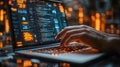 Hands typing on a laptop with glowing orange digital lights, symbolizing technology, coding, and futuristic innovation Royalty Free Stock Photo