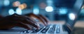 The hands typing on a laptop illuminated by soft ambient light and digital data.AI generated image Royalty Free Stock Photo