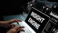 Hands Typing on Laptop with Insight Engine Concept and Dynamic Data Visualization Graphics in a Modern Workspace Royalty Free Stock Photo