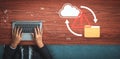 Hands typing on laptop keyboard above wooden table with cloud icon and folder symbol indicating data transfer, storage Royalty Free Stock Photo