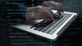 Hands typing on a laptop keyboard with code and data visually represented in a digital theme featuring blue and green Royalty Free Stock Photo