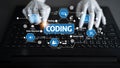 Hands typing on laptop keyboard with coding concept overlay showcasing data structure, testing, source code, process Royalty Free Stock Photo