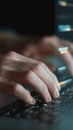 Hands typing on a laptop keyboard, creating code and data streams for software development, cybersecurity, and advanced digital Royalty Free Stock Photo