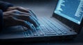 Hands Typing on Laptop Keyboard with Data Code Screen in Dark Environment Royalty Free Stock Photo