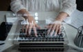 Hands Typing on Laptop Keyboard with Digital Graphs and Data Overlays Representing Modern Business Analytics and Royalty Free Stock Photo