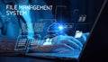 Hands typing on a laptop keyboard with digital icons representing file management technology Royalty Free Stock Photo
