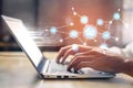 Hands typing on laptop keyboard with digital interface and network connections representing technology, data analysis Royalty Free Stock Photo