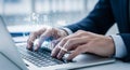Hands typing on laptop keyboard with floating business graphics in professional office environment Royalty Free Stock Photo