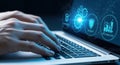 Hands typing on laptop keyboard with futuristic blue digital interface and data visualization Royalty Free Stock Photo