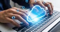 Hands typing on laptop keyboard with glowing cloud and data icons representing digital transformation Royalty Free Stock Photo