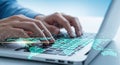 Hands typing on a laptop keyboard with glowing digital data streams abstract overlay Royalty Free Stock Photo