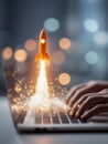 Hands typing on laptop keyboard with glowing miniature rocket launching upward symbolizing technology innovation and digital Royalty Free Stock Photo