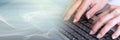 Hands typing on a laptop keyboard, light effect. panoramic banner Royalty Free Stock Photo