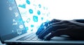 Hands typing on laptop keyboard surrounded by glowing digital icons and data streams Royalty Free Stock Photo